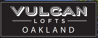 A black and white sign that says Vulcan Lofts Oakland.